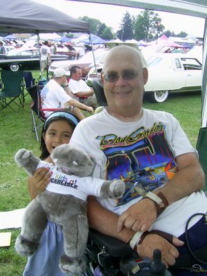 Curt with his lovely daughter Grace at Carlisle 2010
Curt’s health has made it difficult to get around much, but in 2008 he, Jo Ann and daughter Grace made it to the Carlisle All-Chrysler Nationals, where many like-minded ’59 Plymouth enthusiasts dropped their jaws to see such a stunning customization. They had to skip the show in 2009 but came back in 2010 and we hope to see them every year from now on. 
