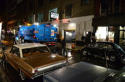 Wetting_down_the_street_for_that_wet_look_that_all_the_films_like_to_have.jpg